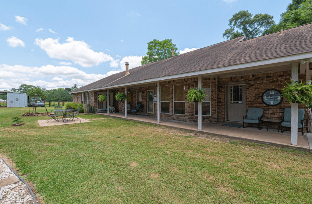Exterior of a home for sale in Conroe, TX showing covered porch.