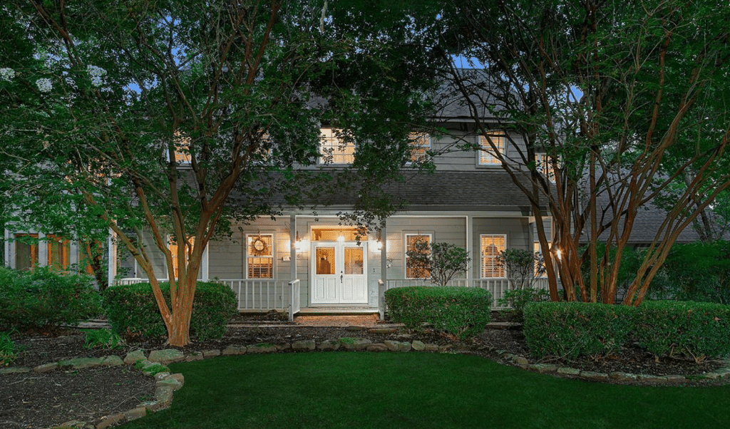 Exterior of a home for sale in Conroe, TX showing manicured landscaping.