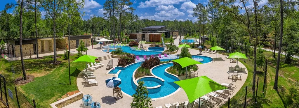 Resort-style pool and lazy river at The Woodlands Hills amenity center in Montgomery County, TX